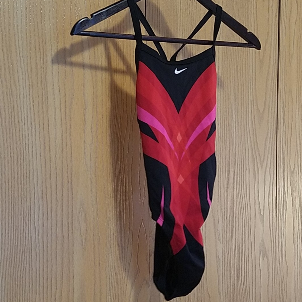 Swimming suit Nike! Like new condition! Has a slight chlorine smell!